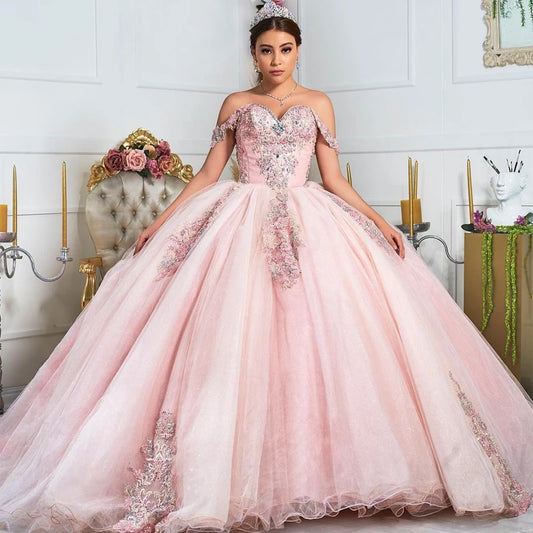 Make a grand entrance at your quinceañera with our stunning Pink Sweetheart Ball Gown, designed specifically for young ladies celebrating their 15th birthday. This enchanting dress features a captivating sweetheart neckline that beautifully frames the shoulders and adds an air of elegance to your special day. Crafted with exquisite attention to detail, the gown is adorned with intricate appliqué lace and shimmering beading, creating a magical look reminiscent of a Cinderella fairy tale.

